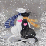 Влюбленные кот и кошечка под снегопадом