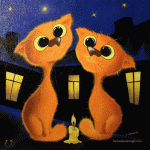 Две рыжие кошки у горящей свечи
